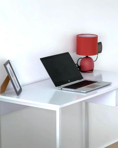 a white desk with a laptop and a red lamp at Karim Palace ,Five Stars Quality With Low Budget, Near The Beach And Airport in Tangier