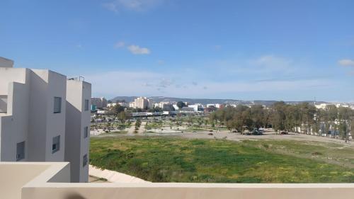 a view of a parking lot from a building at Karim Palace ,Five Stars Quality With Low Budget, Near The Beach And Airport in Tangier