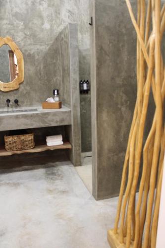 a bathroom with a sink and a mirror at VILLA Bléanah in Santo Aleixo