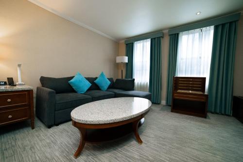 a living room with a couch and a table at Hotel Stanford in New York
