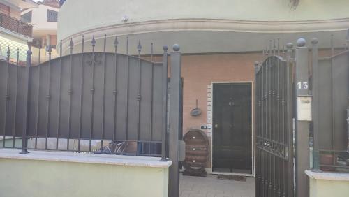 an entrance to a building with a black gate at A casa di Alessia in Santa Maria delle Mole