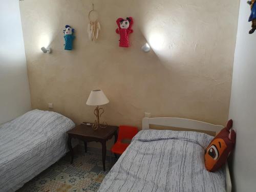 Postel nebo postele na pokoji v ubytování Pitaya