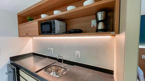 Dapur atau dapur kecil di Jardins Almare Apart Hotel