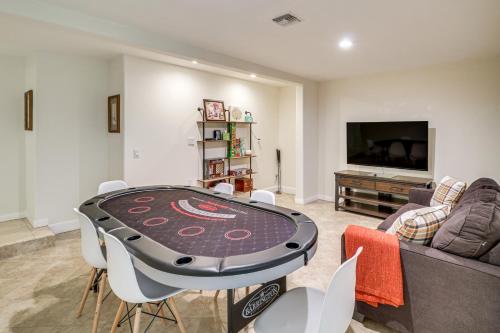 a living room with a table and a couch at Play, Swim and Unwind Luxe Los Angeles Oasis! in Chatsworth Lake Manor
