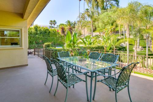 a patio with a glass table and chairs at Play, Swim and Unwind Luxe Los Angeles Oasis! in Chatsworth Lake Manor
