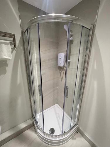 a shower with a glass door in a bathroom at CoStays Aparthotel - Middlesbrough in Middlesbrough