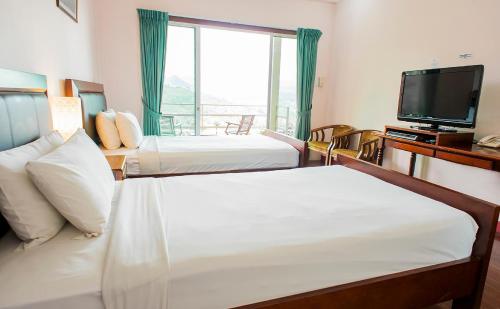 Postel nebo postele na pokoji v ubytování Celyn Resort Kinabalu