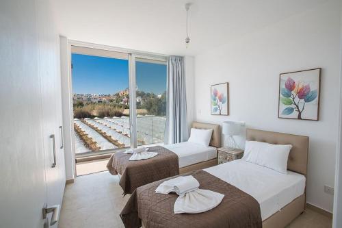 Postel nebo postele na pokoji v ubytování Villa Olive Chrysos, Brand New, Luxury 3 Bdr Protaras Villa, With Private Pool