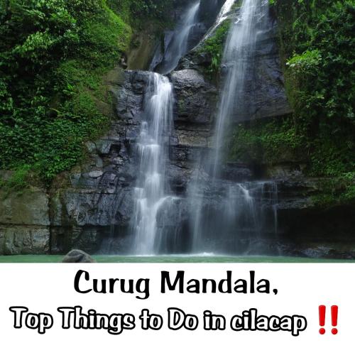 a waterfall in the jungle with text overlaycu ring mandela top things to do at Cilacap Guest House , Penginapan lokasi strategis di Depan terminal bus cilacap in Cilacap