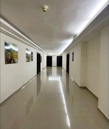 an empty hallway with paintings on the walls at Hotel Aventura suite in Boca de Aroa