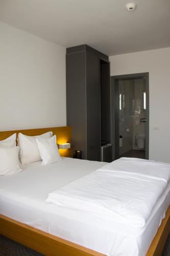 Cama o camas de una habitación en Hotel Silva