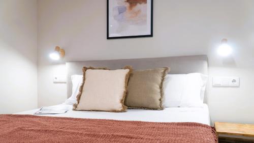 Ένα ή περισσότερα κρεβάτια σε δωμάτιο στο Apartamentos Carolina by gaiarooms