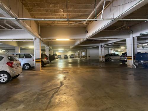 an empty parking garage with cars parked in it at Penthouse en ubicación principal con terraza privada y todas las amenidades en la propiedad, en el corazón de Playa del Carmen in Playa del Carmen