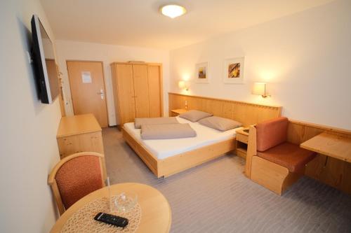 Postel nebo postele na pokoji v ubytování Alpshotel Bergland