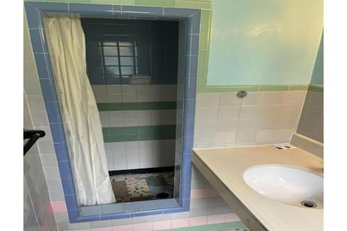 a bathroom with a sink and a shower at Hospitality Inn By Belvilla Selma US 80 AL in Selma