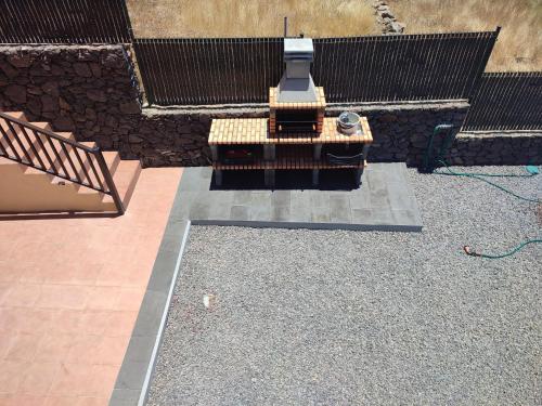 an aerial view of a patio with a barbecue grill at Villa las Cruces in Alajeró