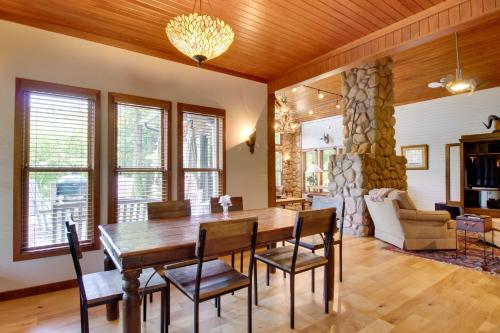 a dining room with a wooden table and chairs at White River Access and Views Retreat in Gassville! in Gassville