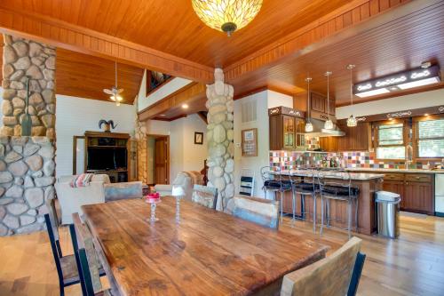 a large room with a wooden table and a kitchen at White River Access and Views Retreat in Gassville! in Gassville