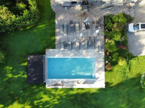an overhead view of a swimming pool in a yard at Landhaus Flasch in Wagrain