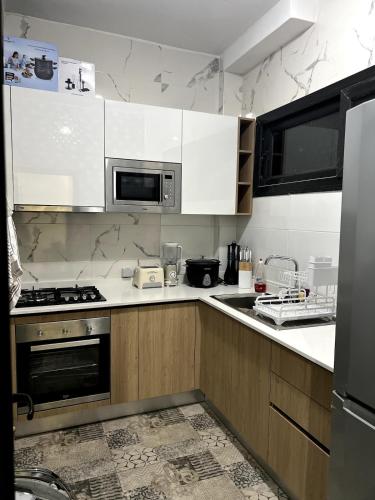 Η κουζίνα ή μικρή κουζίνα στο Appartement F3 élégant et tout confort