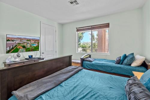 a bedroom with two beds and a window at Las Palmas 1805 Shared Pool and Hot Tub, Great Clubhouse Amenities in St. George
