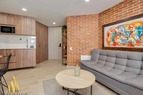 a living room with a couch and a table at Kyux 405 - The Icon of Exclusivity in Laureles in Alpujarra