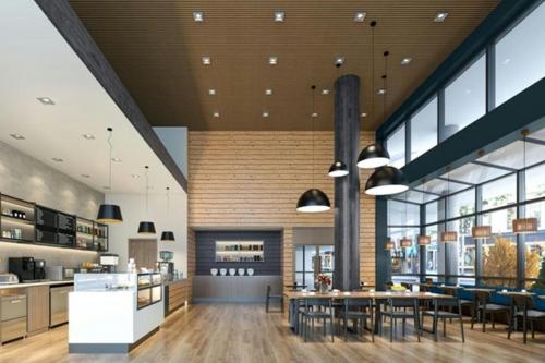 a restaurant with tables and chairs in a building at Element Seattle Downtown in Seattle