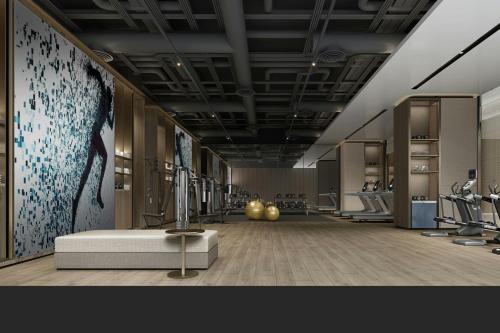 a room with a gym with a treadmill at Sheraton Kunshan Dianshan Lake in Kunshan