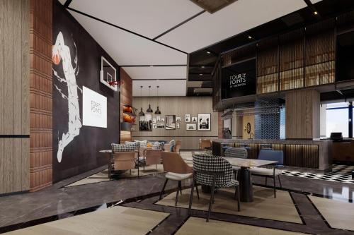 a restaurant with tables and chairs in a lobby at Four Points by Sheraton Mianyang in Mianyang