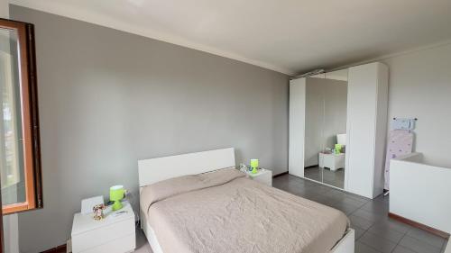 a bedroom with a bed and a large mirror at La casa dei Conti - WiFi, aria condizionata e free park in Vezza d'Alba