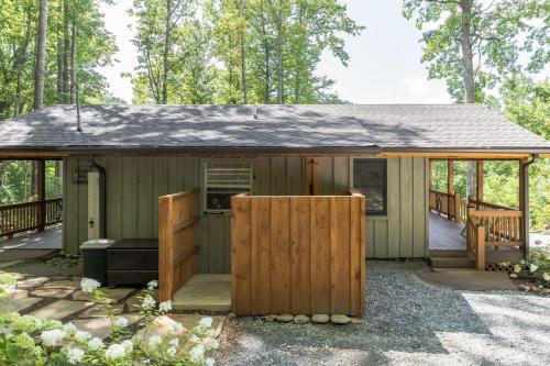 a small house with a porch and a deck at Bungalow, Lake Glenville, Amazing Views, & Sauna! in Cullowhee