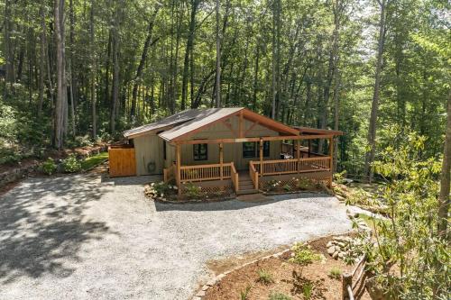 a cabin in the middle of the woods at Bungalow, Lake Glenville, Amazing Views, & Sauna! in Cullowhee