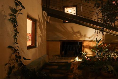 a building with a staircase leading to a window at Incrível Casa Colonial-Déco - Centro Histórico in Marechal Floriano