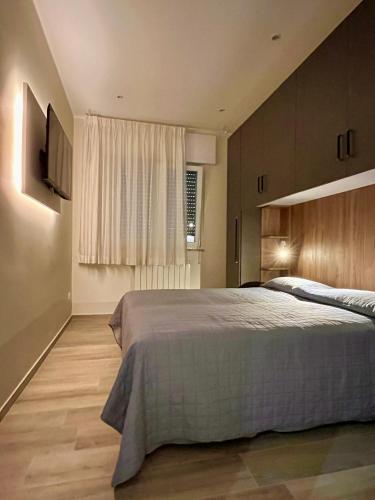a bedroom with a large bed and a window at Vista Mare Luxury Rooms & Apartments in Margherita di Savoia