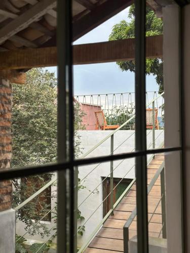 a view of a balcony from a window at Incrível Casa Colonial-Déco - Centro Histórico in Marechal Floriano
