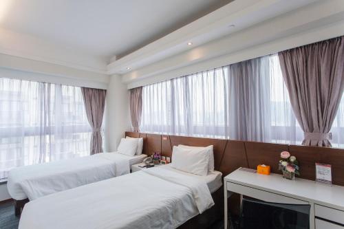 Postelja oz. postelje v sobi nastanitve Le Prabelle Hotel