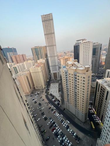an aerial view of a city with tall buildings at AlNahda Border SHJ-DXB -ZAMAZM GuestHouse in Sharjah