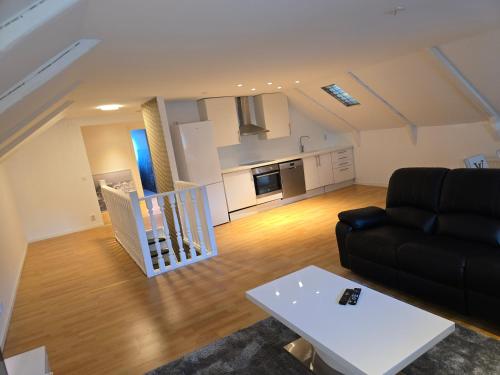 a living room with a couch and a table at Nature Park View in Röstånga