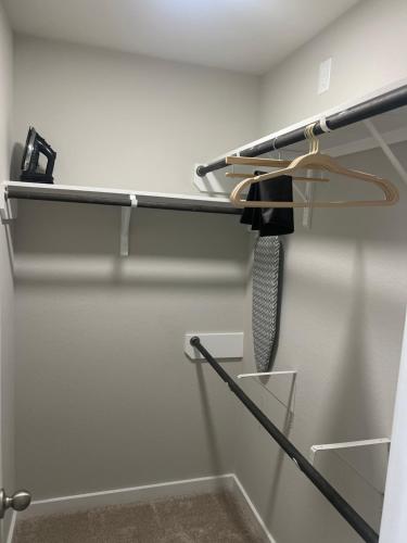 a knife hanging on a rack in a closet at Nanashortlet in Rosenberg