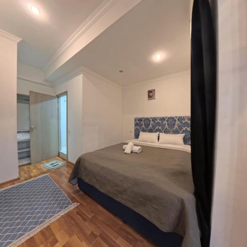 a bedroom with a large bed in a room at Shara Hotel in Mestia