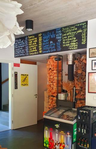 a restaurant with a menu on the wall and a counter at Penzion Kůlna in Slatiňany