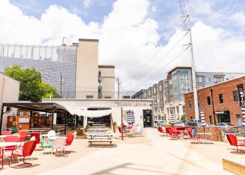 a group of chairs and tables on a city street at The Magnolia Stay in Fort Worth