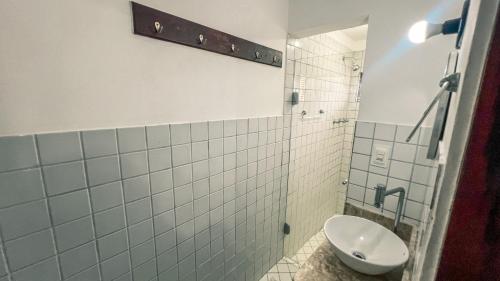 a bathroom with a toilet and a shower stall at Falésia Praia Hotel in Canoa Quebrada