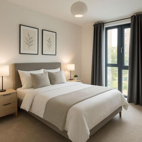 a bedroom with a large white bed and a window at Relaxing city base with great access to transport in London