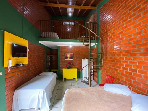 Cama o camas de una habitación en Suites Eco Ville