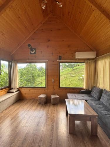 a living room with a couch and a table at SunHouse in Khulo