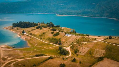 an island in the middle of a body of water at Kuća za odmor Ana in Prozor
