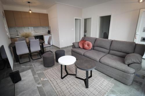 a living room with a couch and a table at Kuća za odmor Ana in Prozor