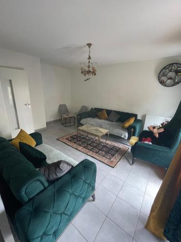 a living room with two couches and a couch at T2 a petite prence in Escalquens