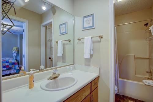 a bathroom with a sink and a mirror at Rivers Edge - #402 in Helen